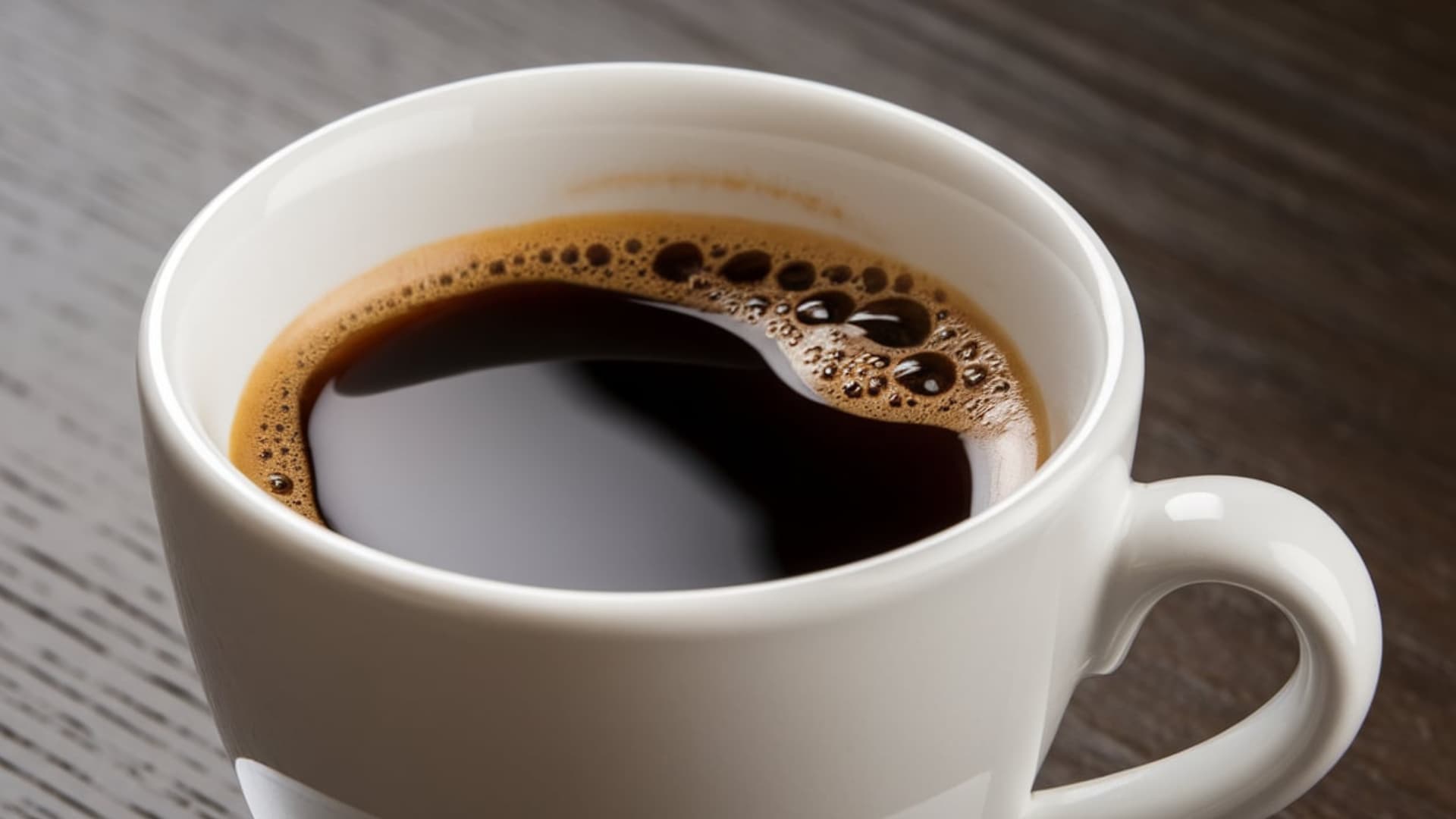 black coffee in white cup minimal top view without sugar or milk simple morning drink concept