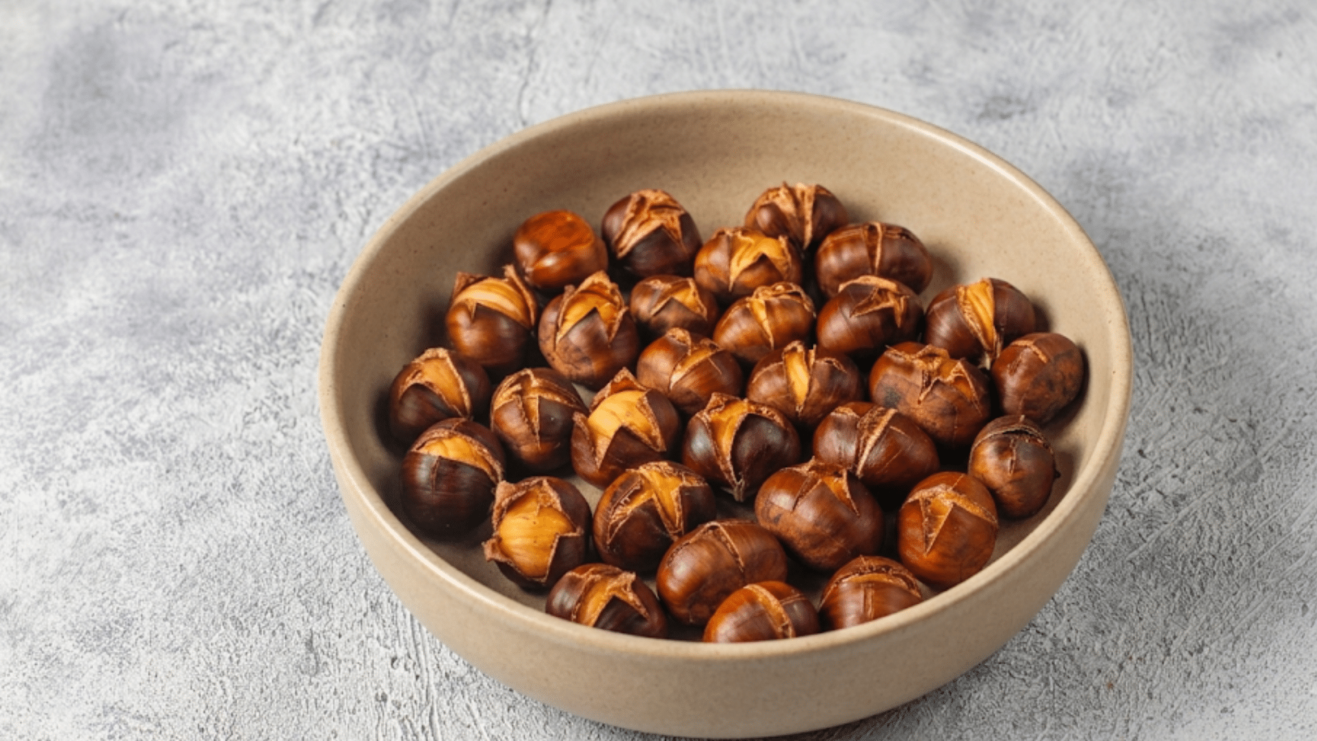 bowl of chestnuts showing a naturally lower calorie nut ready to eat or cook with