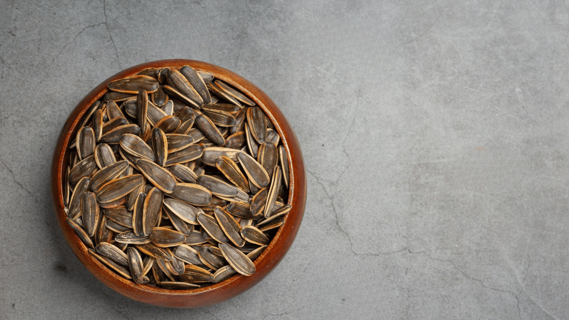 bowl of sunflower seeds showing a healthy snack that provides protein fiber and healthy fats