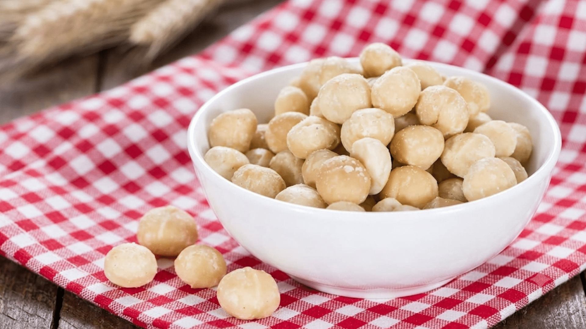 macadamia nuts in a white bowl that are rich in healthy fats and satisfying to eat