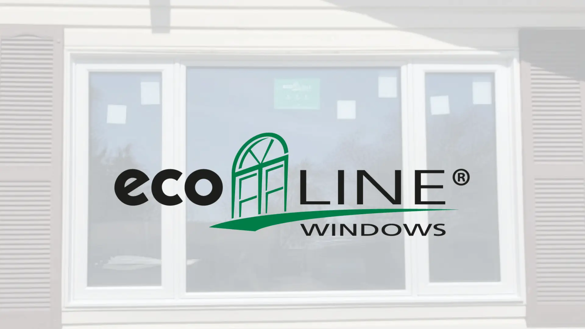 Large white framed window with shutters on an exterior wall