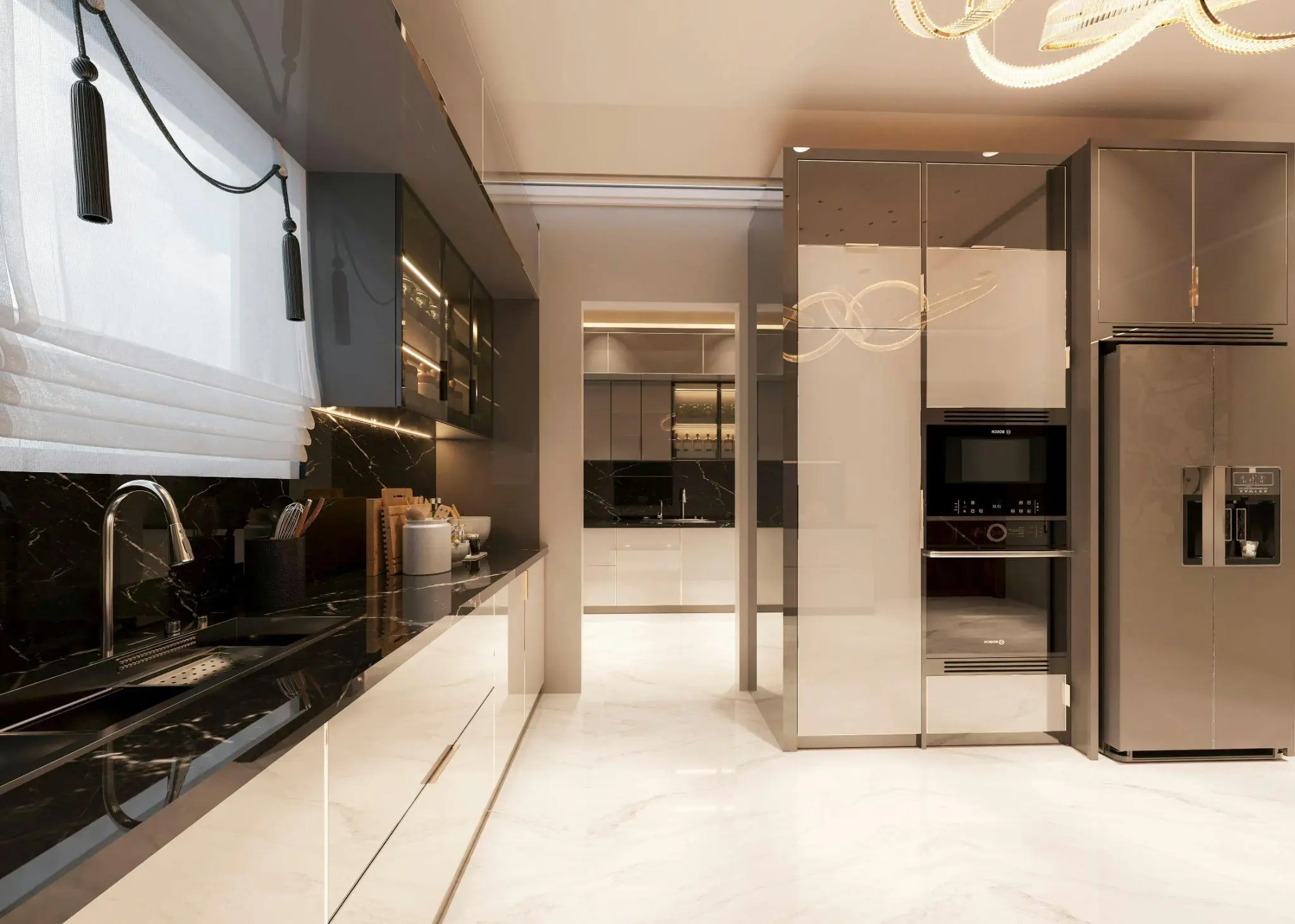 Modern kitchen with sleek black countertops and stainless steel appliances under warm lighting