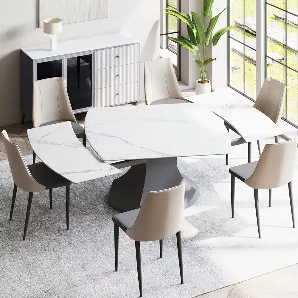 Modern dining room with marble dining table and beige chairs by large windows