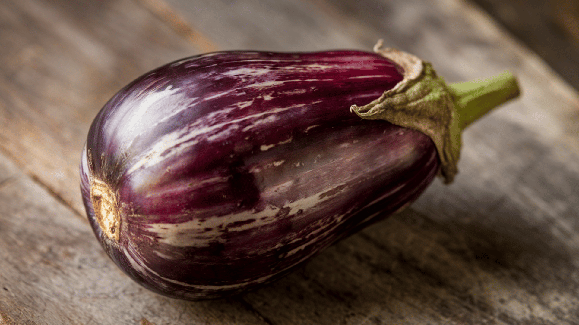a versatile, meaty vegetable with a deep purple skin, perfect for grilling, roasting, or frying.