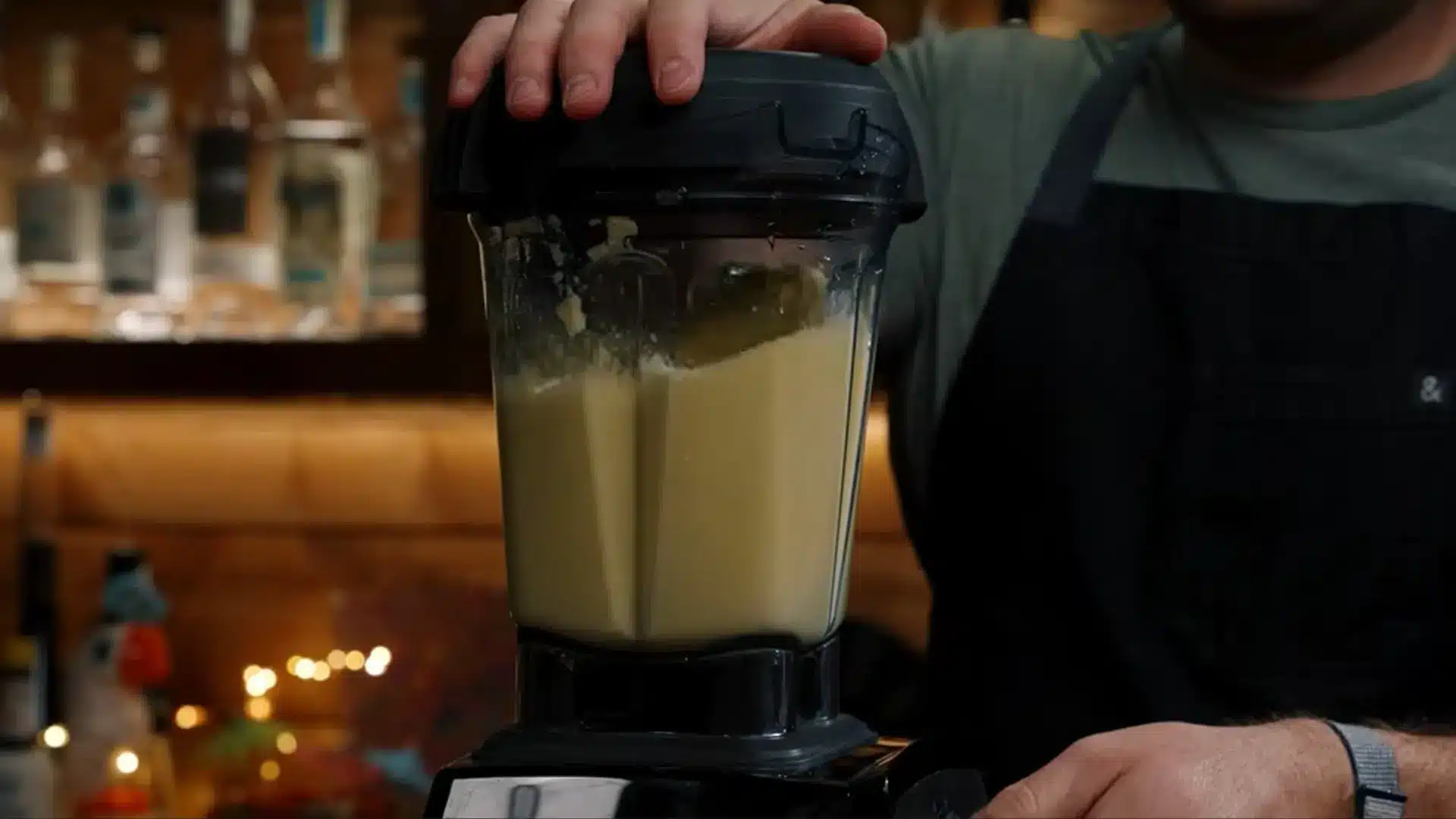 fresh pineapple chunks blending into smooth puree in a mixer for homemade pineapple juice