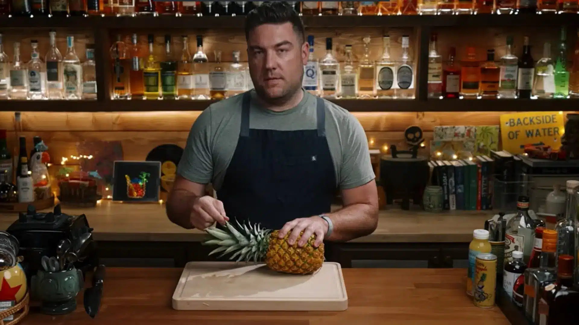 fresh ripe pineapple being washed with water before making homemade pineapple juice