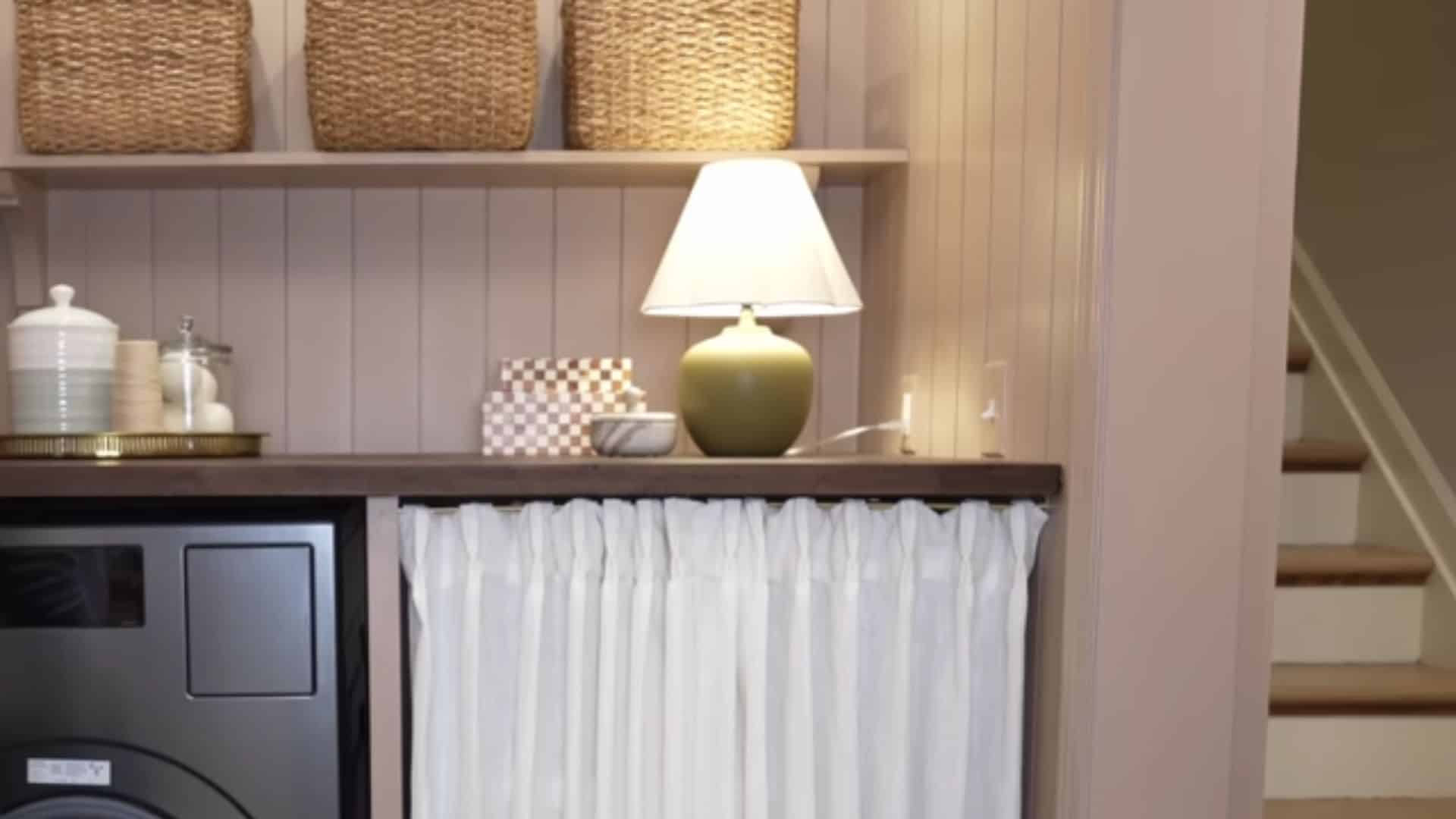 Laundry room shelves with baskets and curtain hiding supplies, creating a clean and less cluttered space. (1)
