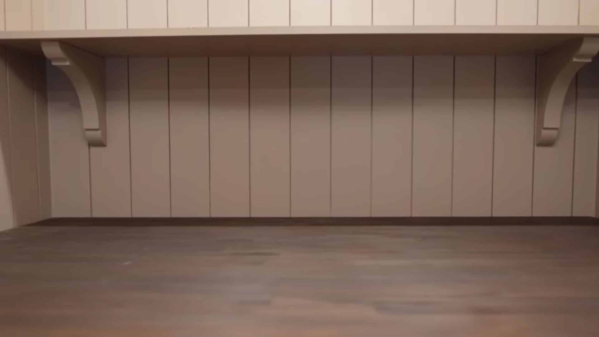 Laundry room with shelves being cleared for a clean, organized setup.