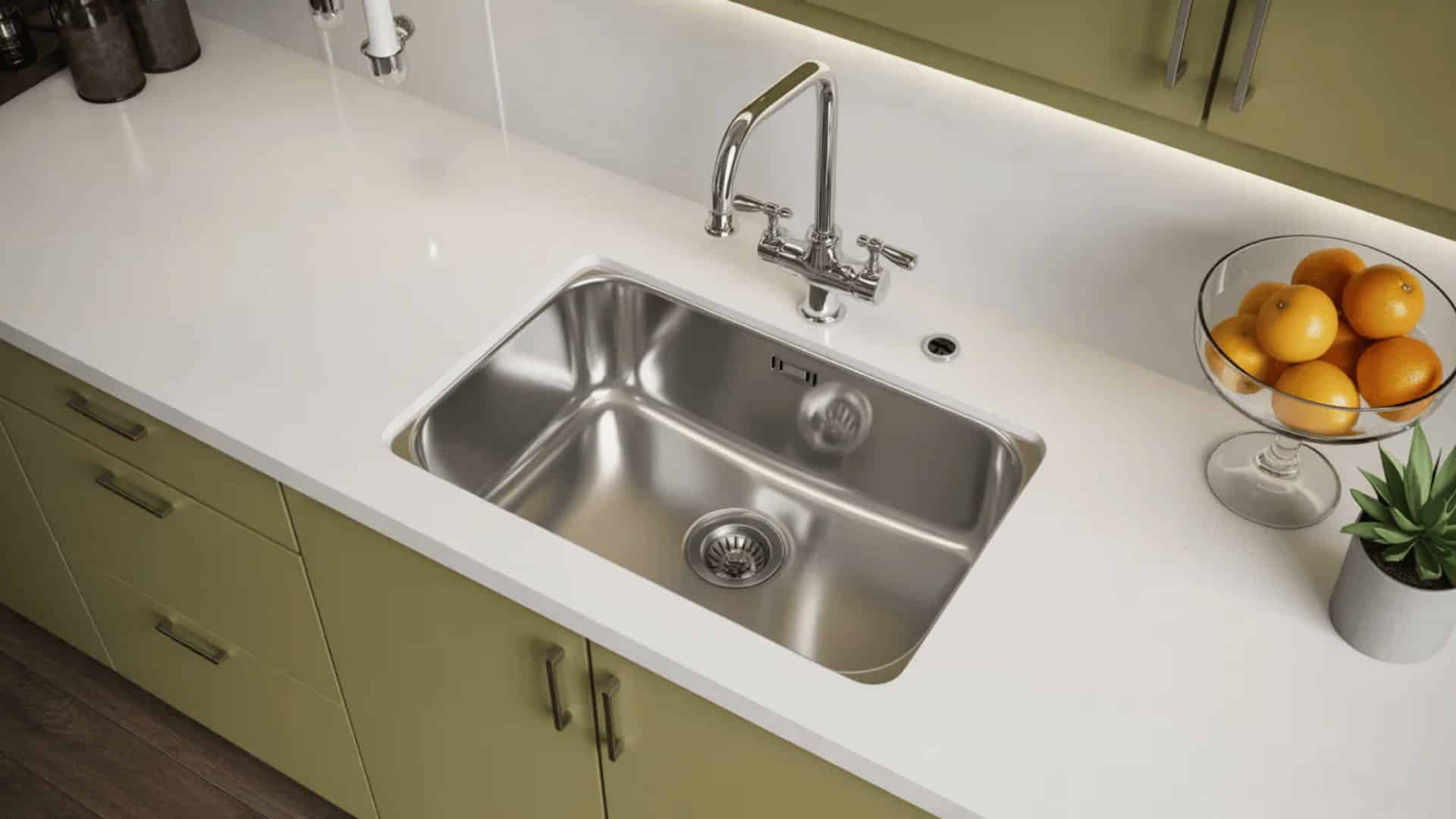 polished stainless steel single bowl sink with deep open basin, chrome gooseneck faucet, white quartz countertop, and olive green cabinets (1)