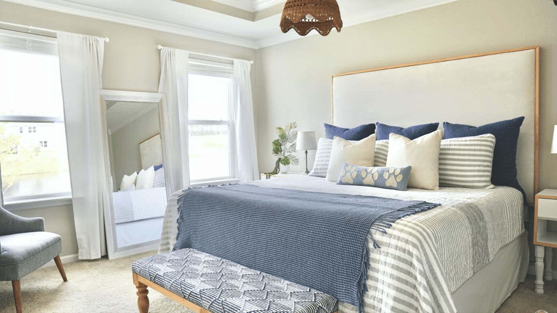 finished diy upholstered headboard installed in a bedroom with a simple wooden trim frame