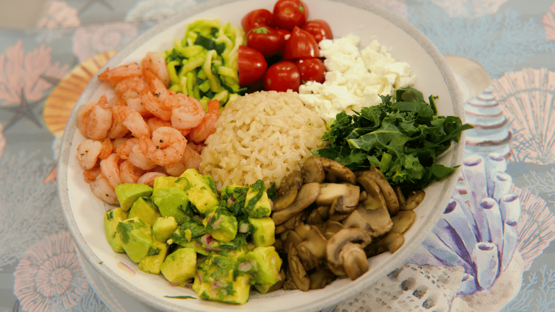 grain bowl with shrimp avocado vegetables tomatoes mushrooms and leafy greens