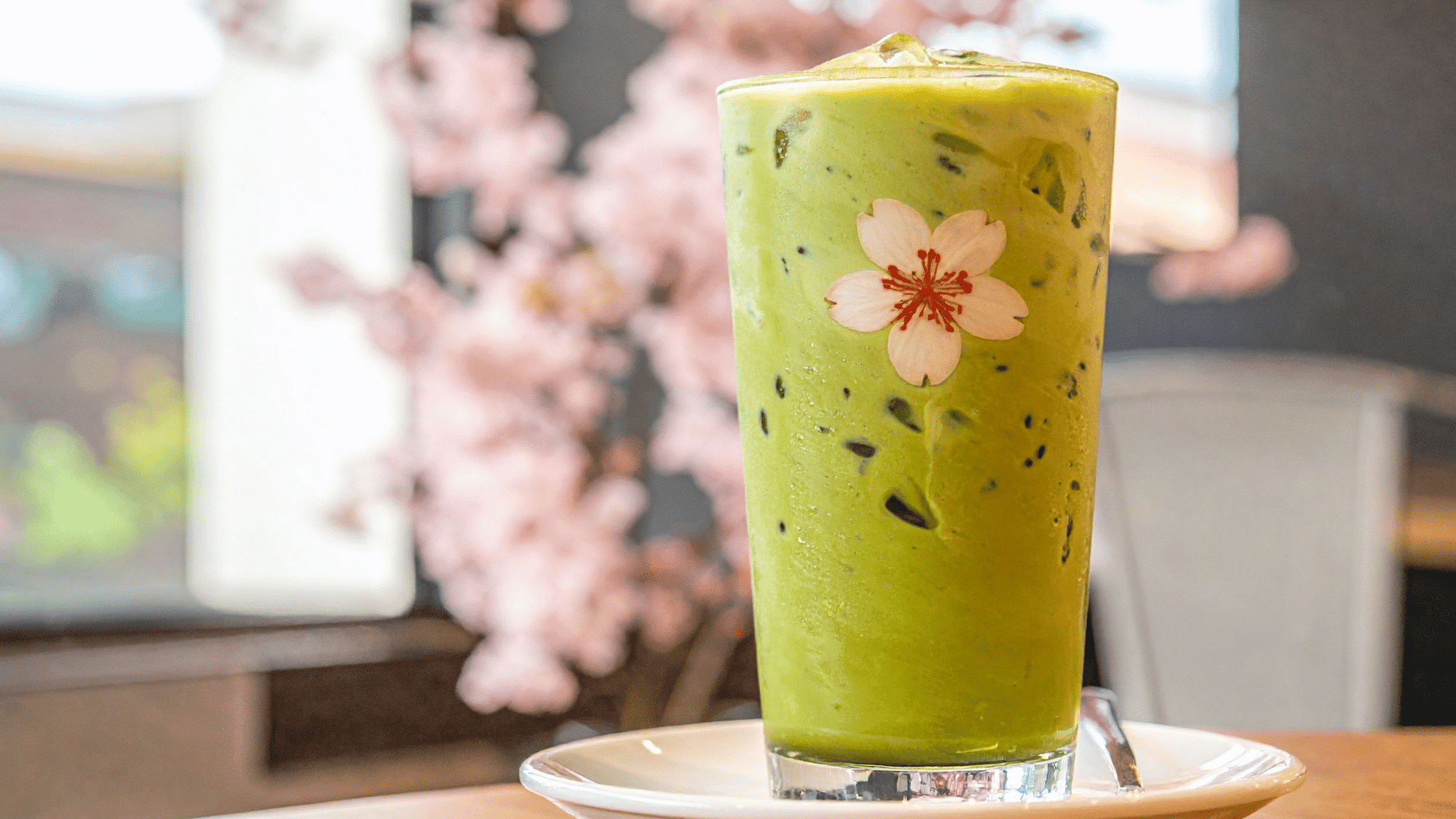 homemade iced matcha latte served in a clear glass with ice