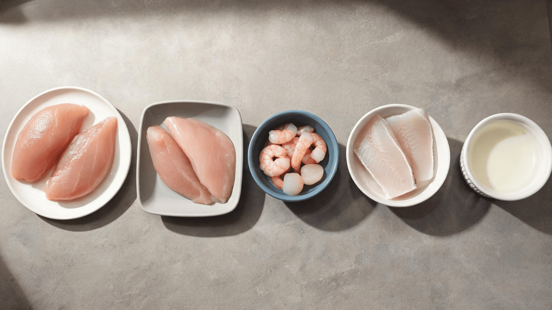 Lean protein sources including chicken, fish, shrimp, and yogurt arranged as heartburn-friendly food options.