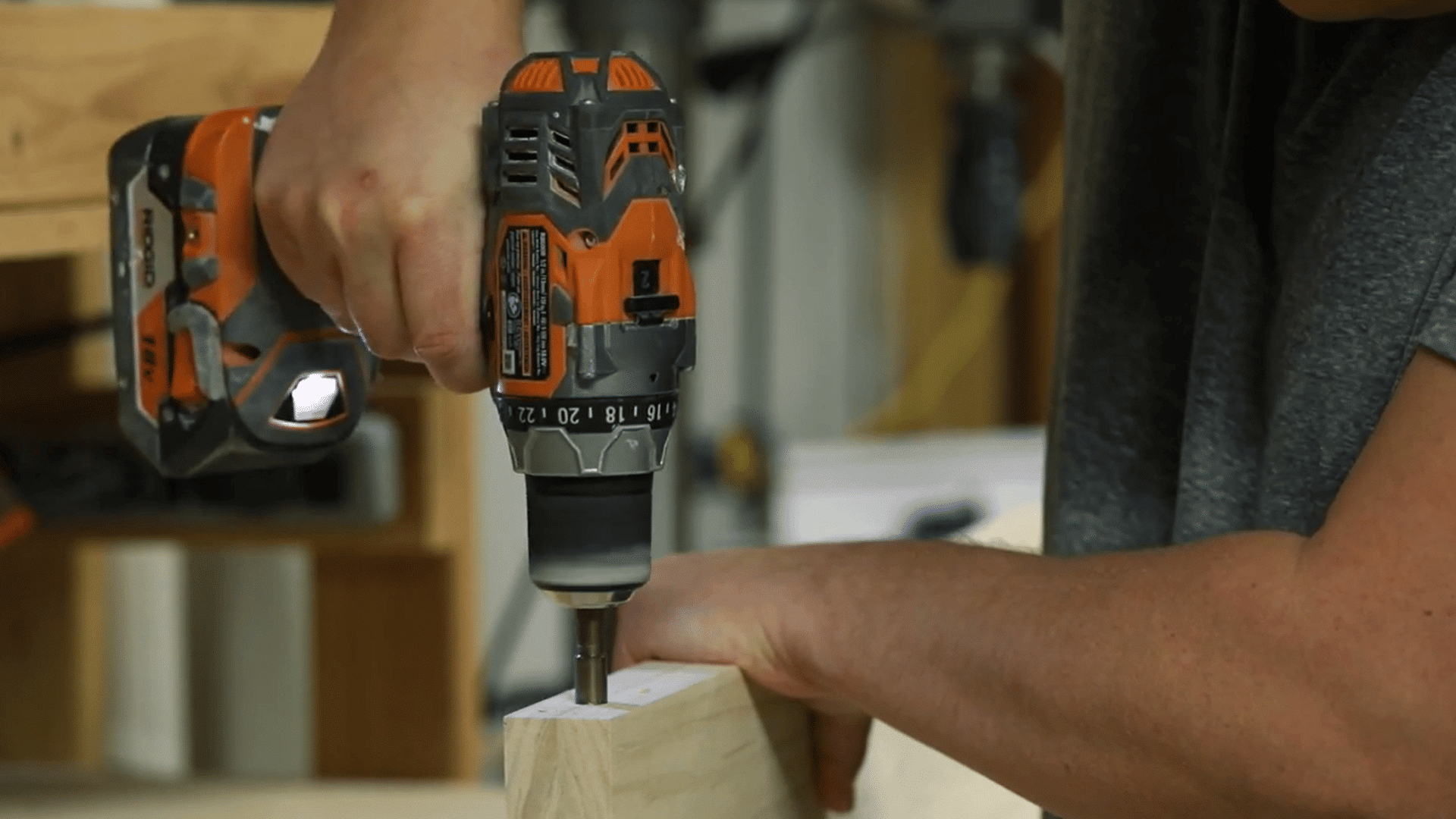 mounting holes being drilled straight into a pine shelf using a drill press and suitable bit