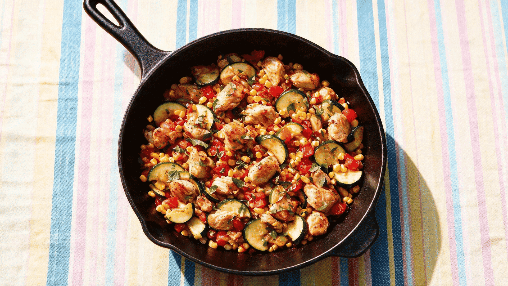 ground chicken and vegetable skillet with zucchini corn tomatoes and fresh herbs
