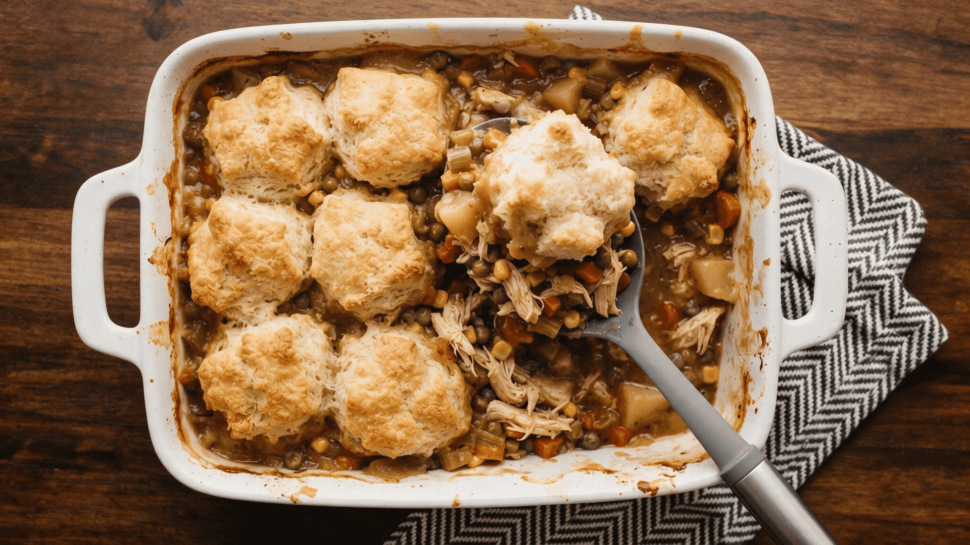 ground chicken biscuit casserole with vegetables savory filling and golden biscuits baked on top