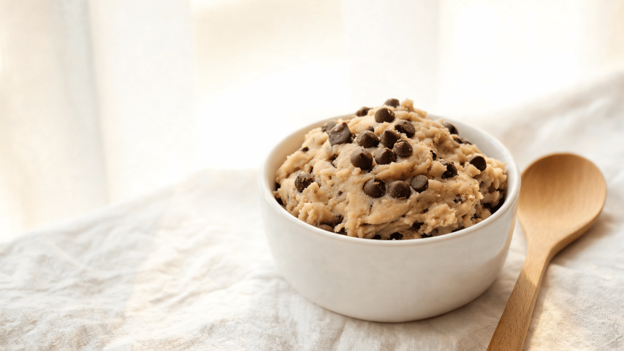 paleo edible cookie dough made with almond flour and chocolate chips in a bowl for a simple sweet treat