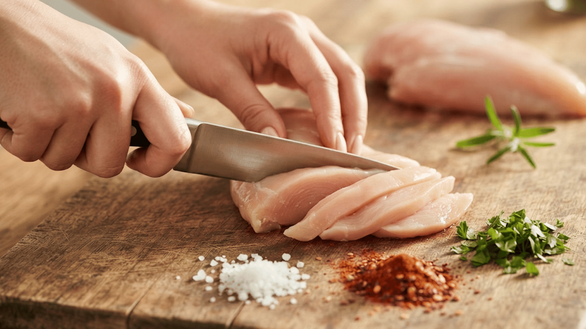 preparing chicken pieces with seasoning and sauce before cooking them for a flavorful chicken stir fry